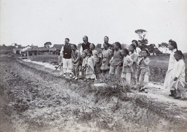 Children laughing by a field