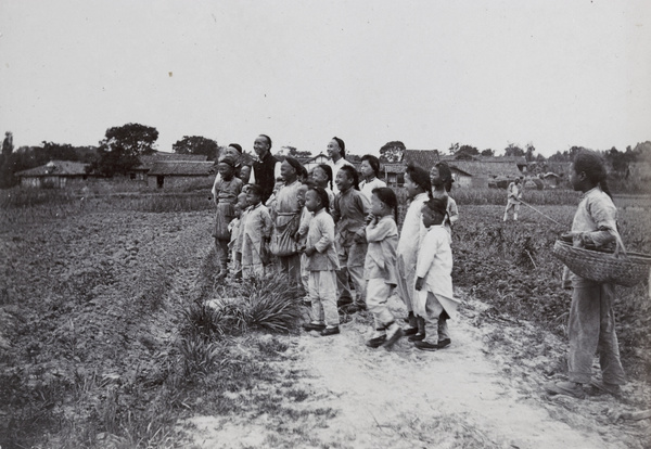 Delighted, laughing group by a field