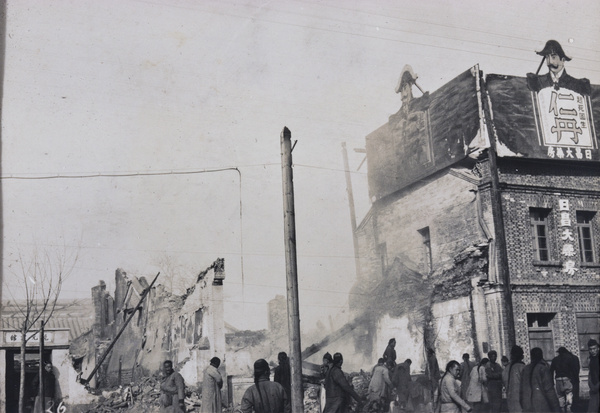 Ruins of buildings near Dongdan Pailou and advertisement for Jintan (仁丹), after riots, Peking Mutiny 1912