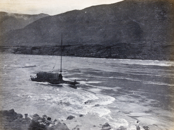 Sampan negotiating rapids