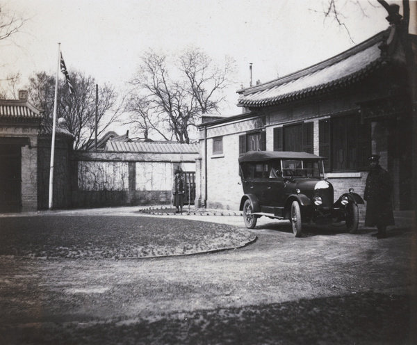 Driver and car in front of compound, Beijing