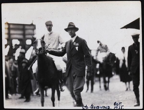 Man leading the racehorse 'Goodwood'