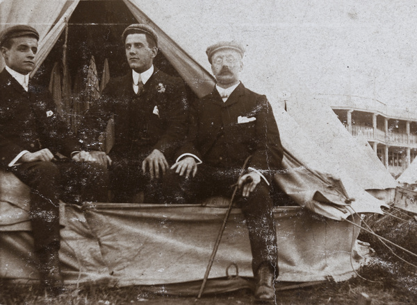 Group sitting in tent