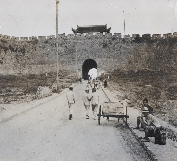 Pedestrians by a city gate and wall, Nanjing (南京市)