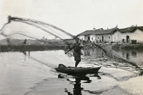 Fisherman casting his net