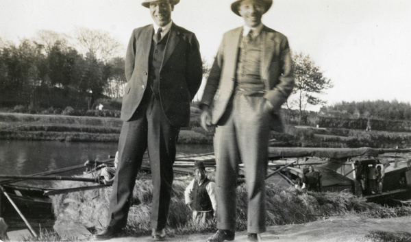 Europeans beside a reed boat, near Shanghai