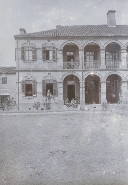 Men in front of a building