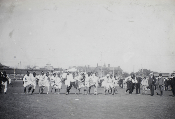 Sikh policemen running three-legged race