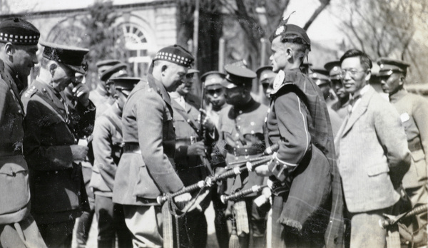 Badham-Thornhill, with Scots Guards bagpipe player, Peking