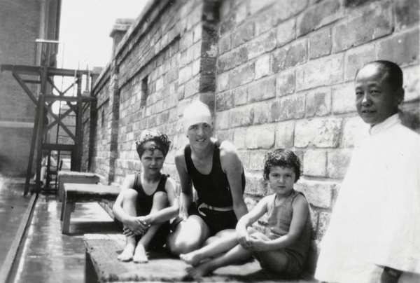 Ann Phipps, with an amah and children, at the American Legation Guard Pool, Beijing
