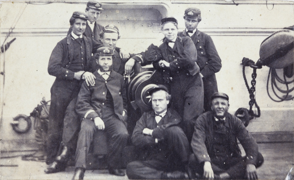 Eight junior Royal Navy officers by a gun, HMS Topaze