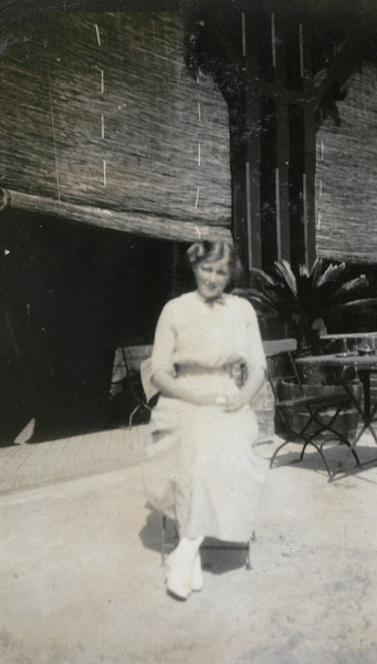 Claude Wallace, sitting by a veranda, Shanghai