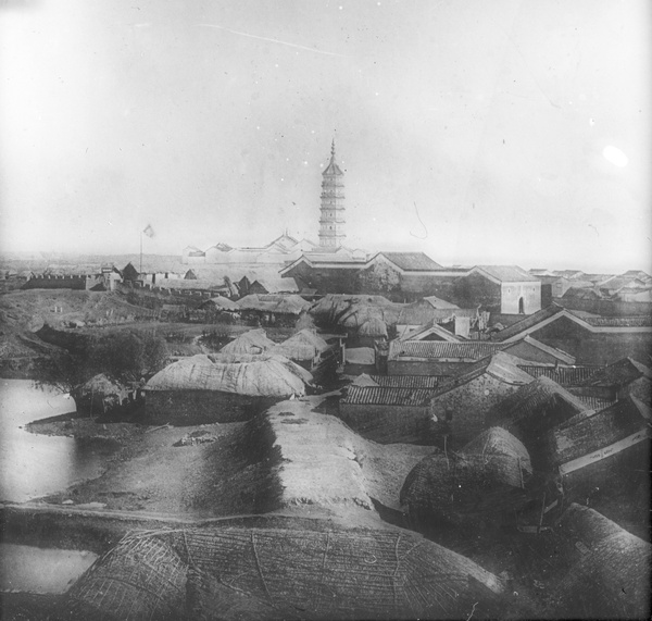 Stores under matting, city walls, and Zhenfeng pagoda, Anqing