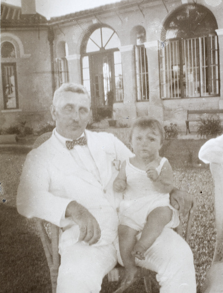 Mr Stevenson, with Wendy Remington on his lap, Hong Kong