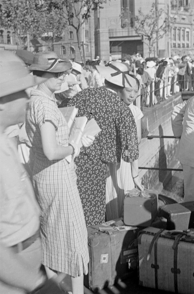 Evacuees and luggage, The Bund, Shanghai