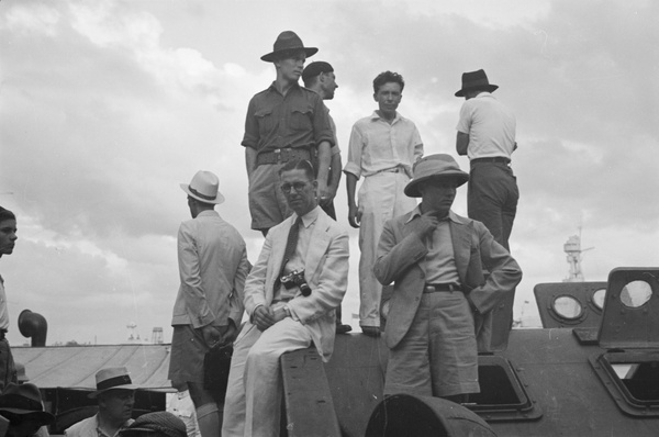 Evacuees on a ferry waiting to leave Shanghai