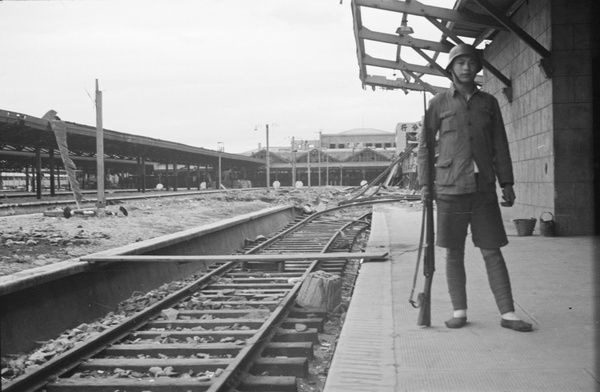 Soldier at bomb damaged North Railway Station, Shanghai