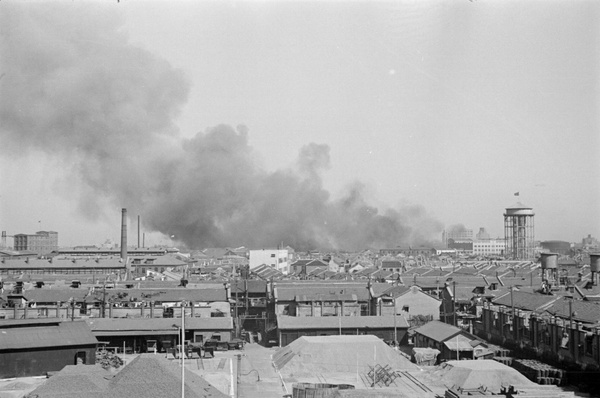 Overlooking stockyard towards smoke