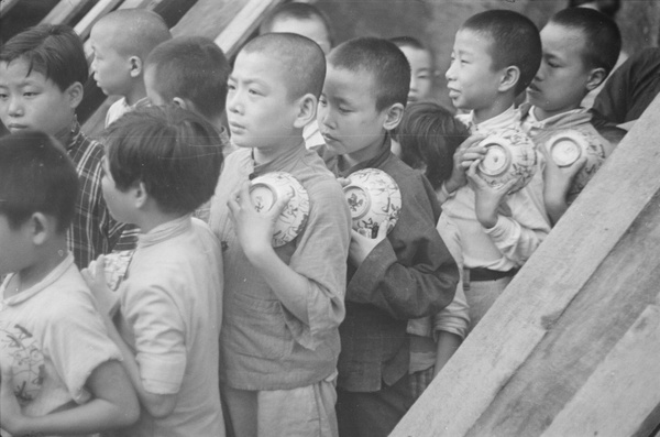 Children queuing, with rice bowls, Shanghai