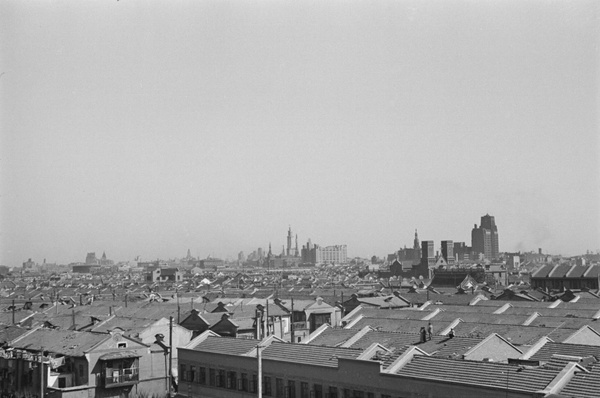 People on rooftop watching fires, Shanghai