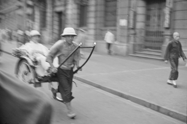 Rickshaw driver and passenger, Shanghai