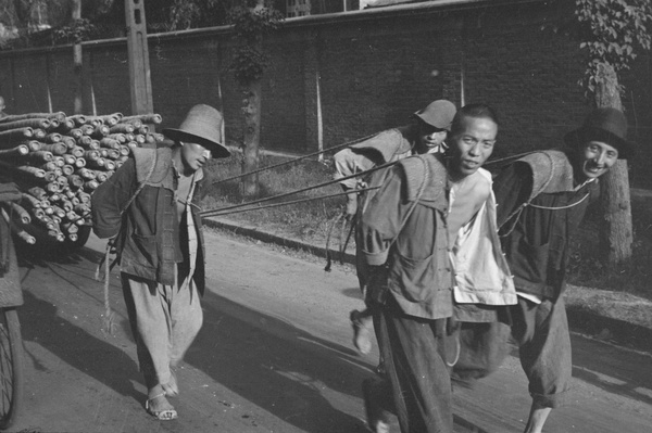 Four men hauling a cart, Shanghai