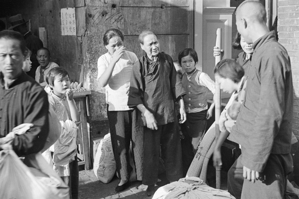 Displaced families and street food seller, Shanghai