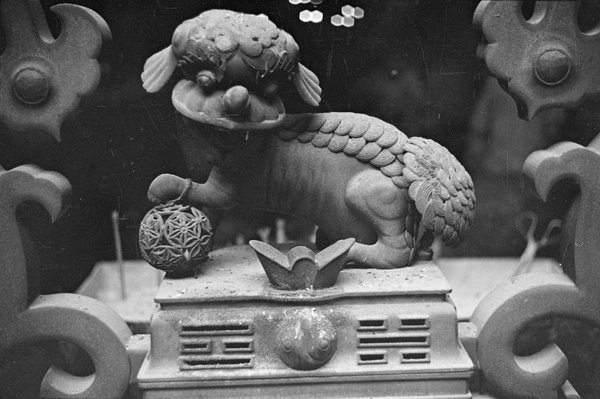Bronze lion on temple altar