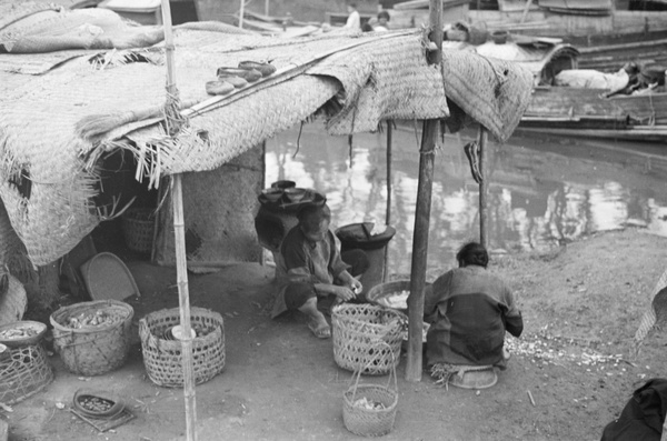 Cooks preparing food at bankside kitchen, Shanghai