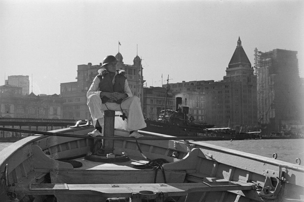 American sailor on bow of USS Augusta tender, Shanghai