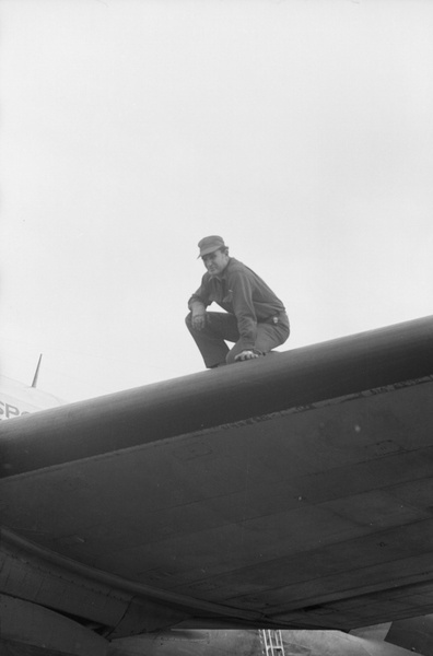 Ground crew man on Civil Air Transport airplane