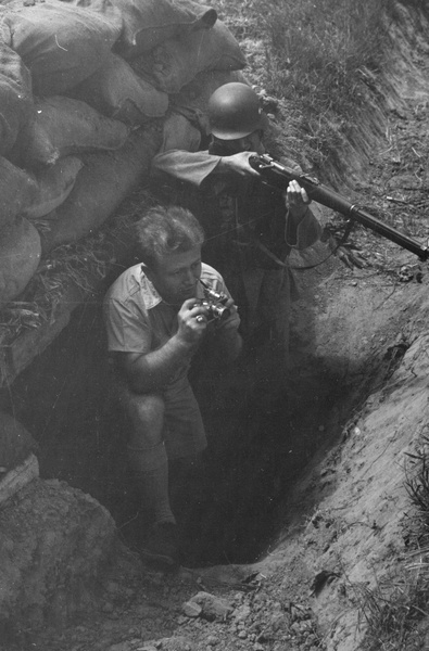 Nationalist soldier by dugout with photographer George Lacks, Shanghai