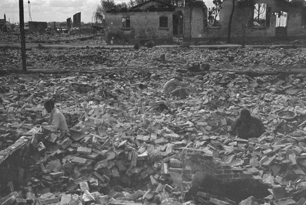 Sorting through rubble in bombed out district, Shanghai