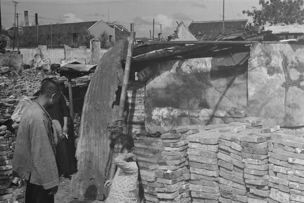 People by temporary shelter in bombed out district, Shanghai