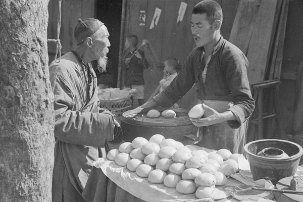 Street food cook, dumplings, and customer, Shanghai