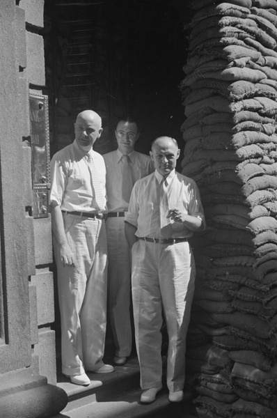 Bank staff outside sandbagged Chase Bank, Kiukiang Road, Shanghai