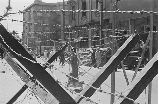 Barbed wire barricade and sandbags, Shanghai