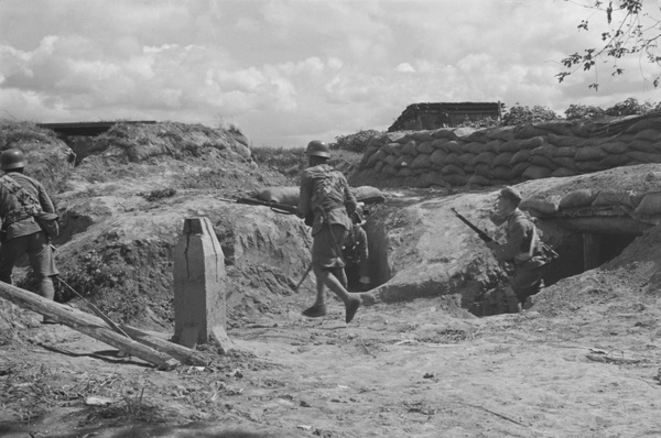 Nationalist soldiers emerging from dugout, Shanghai