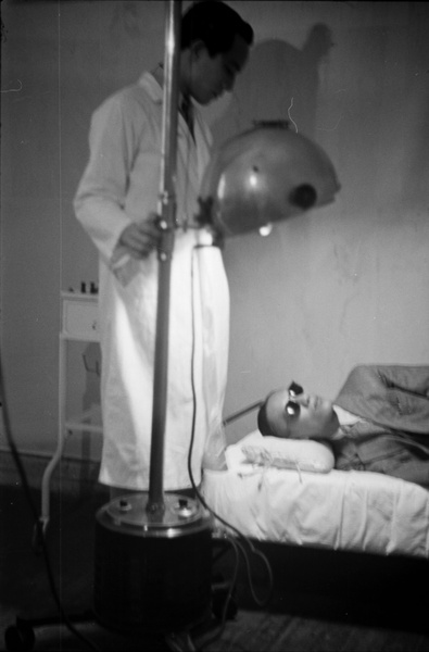 Hospital worker demonstrating medical equipment, Shanghai