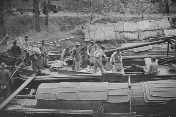 Unloading a barge, Shanghai