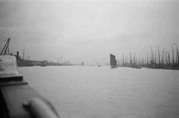 Moored junks and sampans under sail, Shanghai