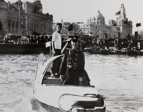 Shanghai Municipal Policeman in a water taxi, Shanghai