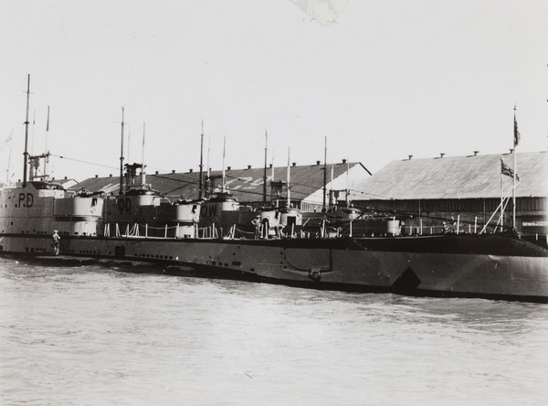 Royal Navy submarines by a godown, Shanghai