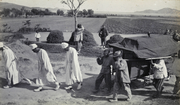 Funeral procession in the countryside