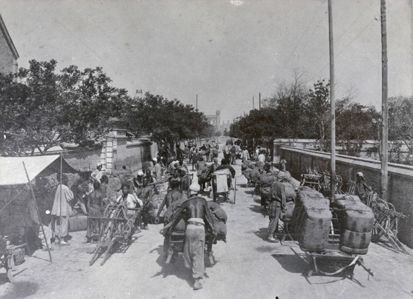 Moving goods along a busy street, Tientsin