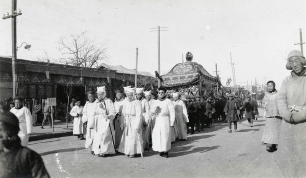 Funeral procession, with mourners dressed in white preceding the coffin, Beijing