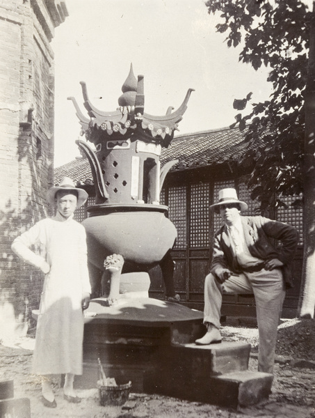 John Sullivan by an incense burner outside a temple