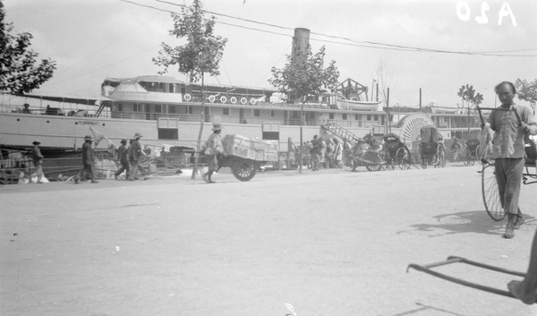 Paddle-steamer 'Pekin' discharging, Shanghai