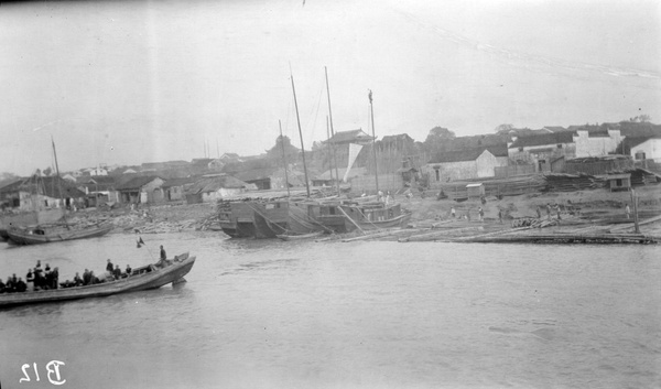 Butterfield and Swire boat and riverside at Kiukiang