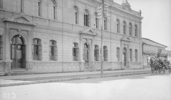 A woman in a coach outside Butterfield and Swire offices in Dalny (大连)